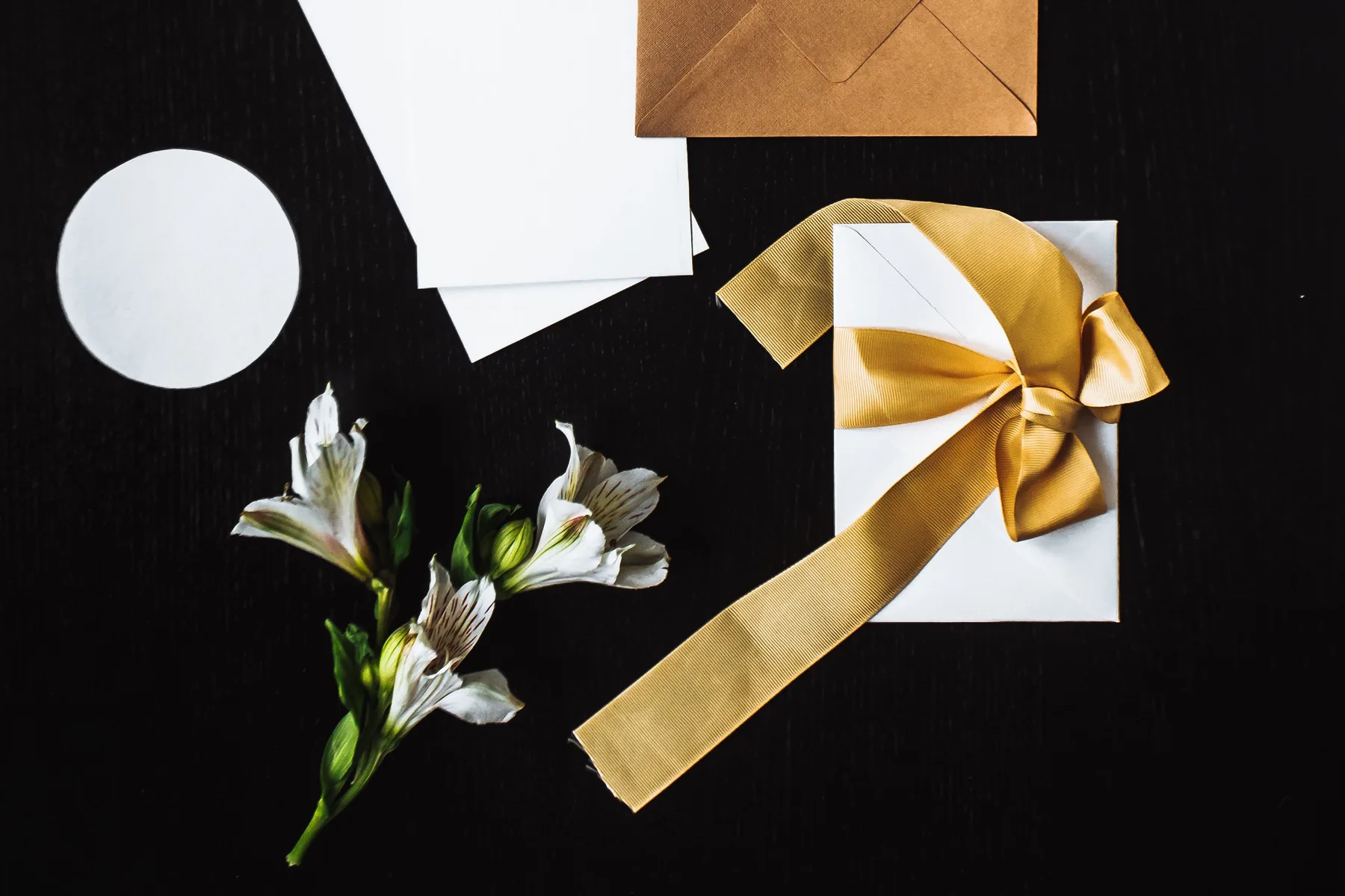 Gift card envelope tied with a gold ribbon