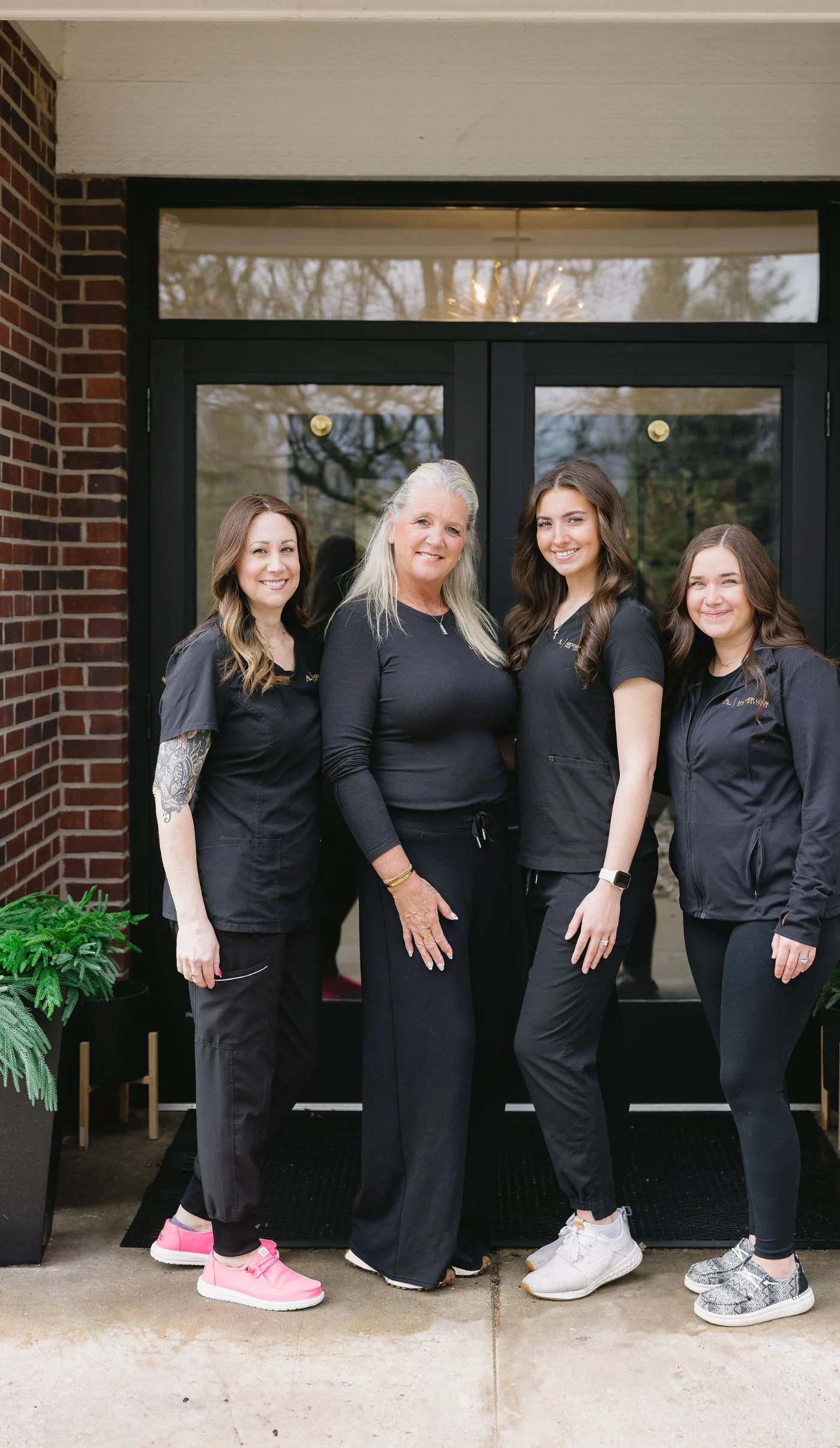Another Look Hair Institute team outside the East Lansing location