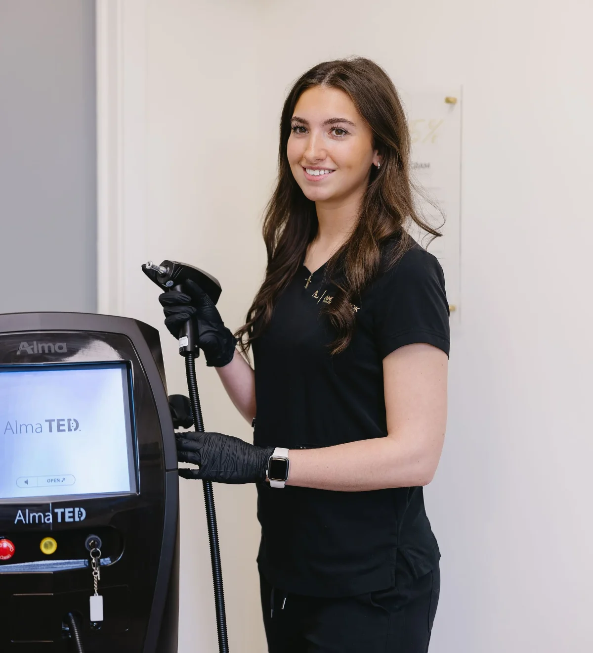 Another Look Hair Institute team member with Alma TED treatment equipment